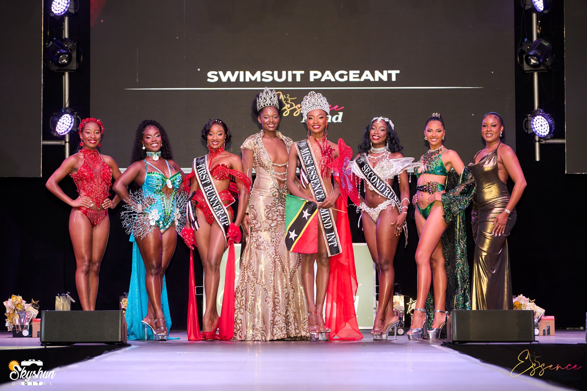 Contestants and organizers celebrating together on stage